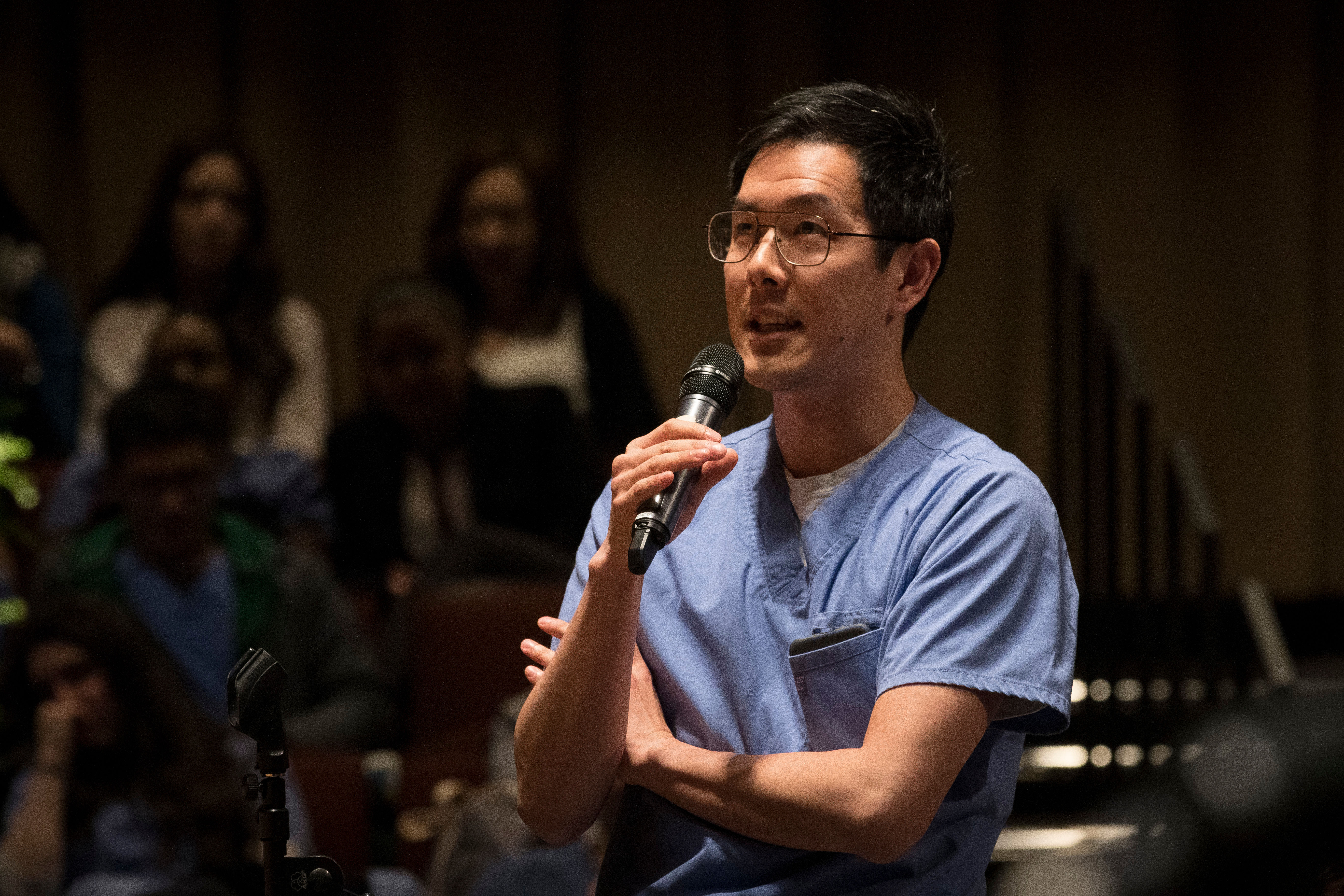 A student asks a question during a Research Day event.