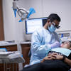 A Temple student-dentist completes a procedure on a community patient.