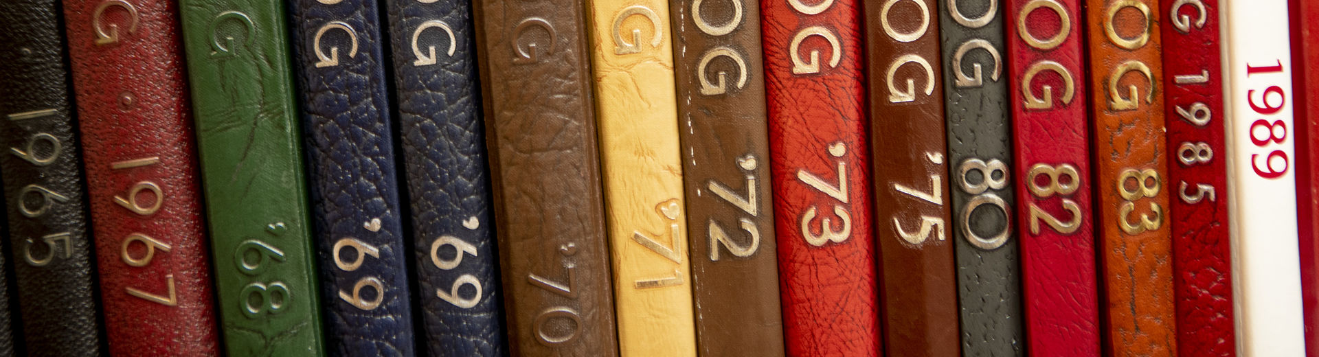 A row of yearbooks from the Kornberg School of Dentistry.