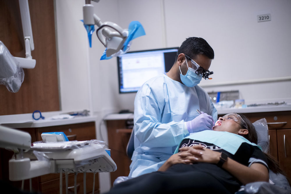 A Temple student-dentist completes a procedure on a community patient.